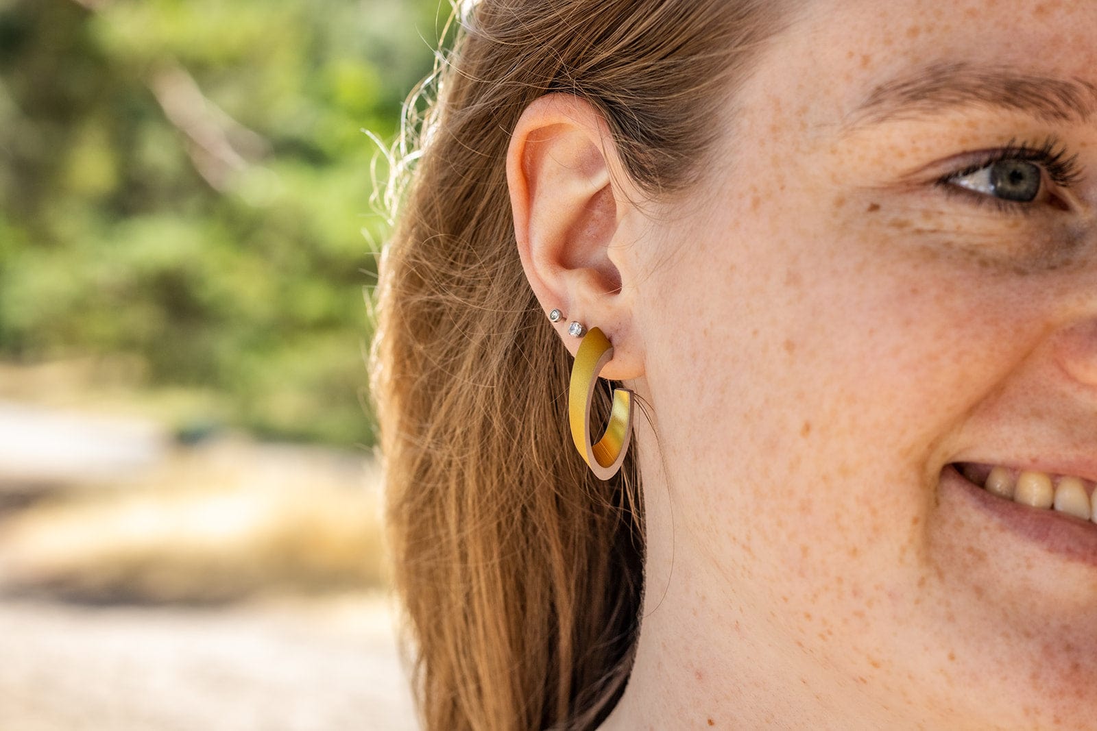 OLIVIA gold-tone earrings worn | oval hoop earrings with a matte finish | CLIC by Suzanne