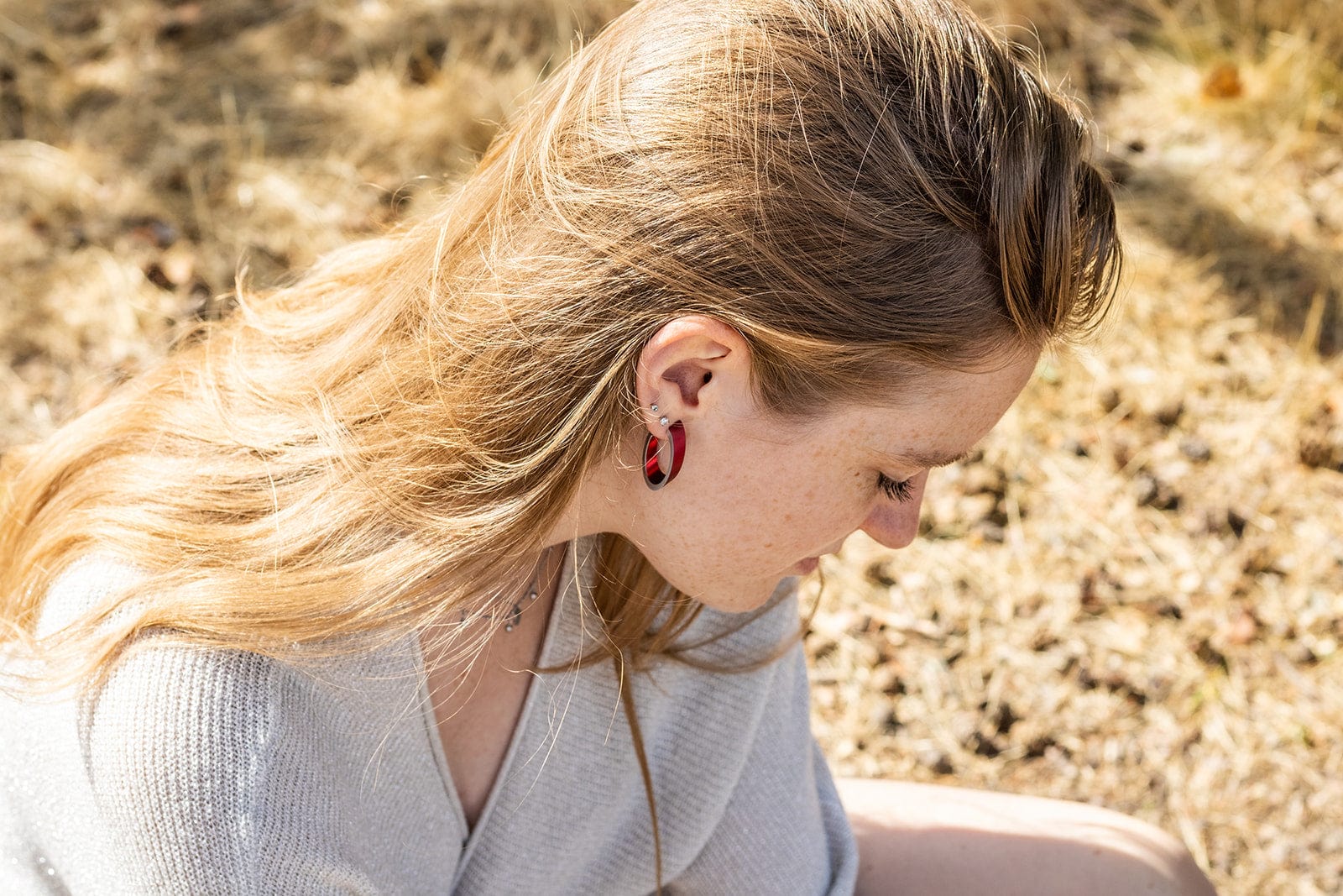 OLIVIA red earrings worn | oval hoop earrings with a matte finish | CLIC by Suzanne