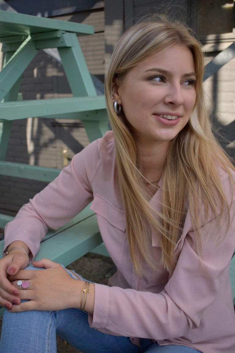 Woman wearing Thinking of You bracelet with bicolour flower charm | CLIC by Suzanne